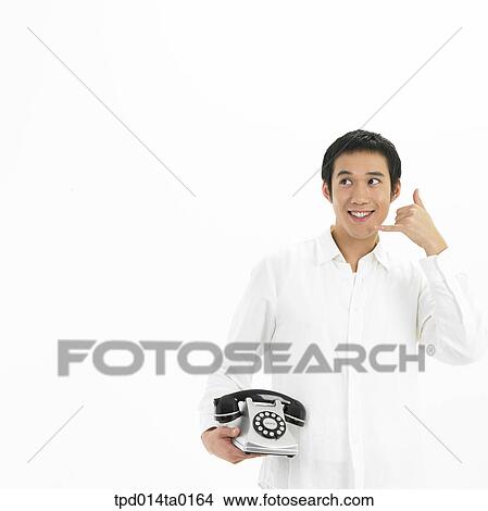 Picture - object, Asian, person, bust, telephone, gesture. Fotosearch