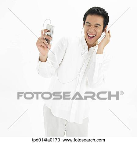 object, Asian, person, smile, listening to music, gesture View Large Photo Image Stock Image - object, Asian, person, smile, listening to music, gesture. Fotosearch
