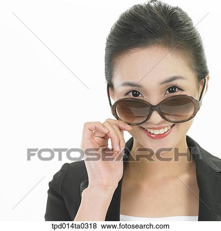 Stock Photo - object, Asian, person, sunglasses, woman, smile, portrait. Fotosearch