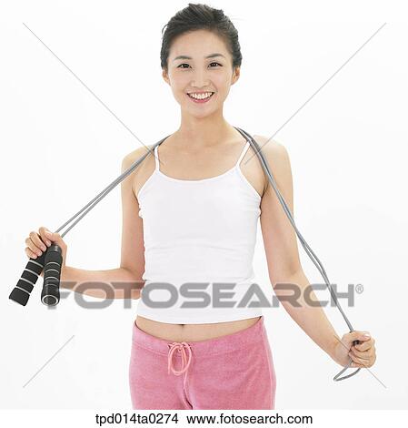 Picture - object, Asian, person, woman, exercise, smile, rope-jumping. Fotosearch