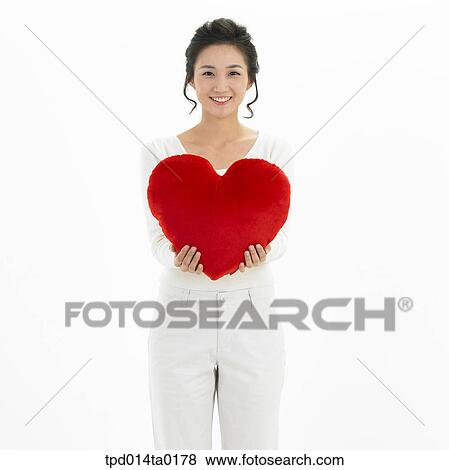 Stock Photo - object, Asian, person, woman, smile, portrait, cushion. Fotosearch