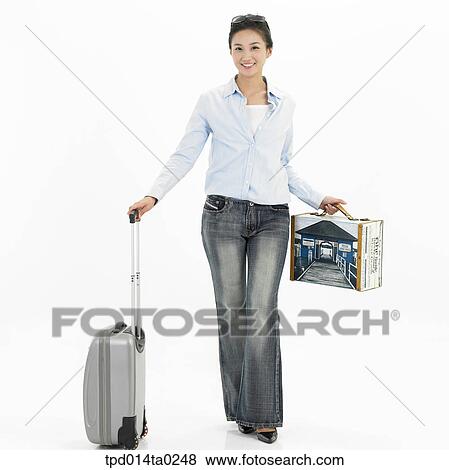 Stock Photo - object, Asian, person, woman, trip, suitcase, smile. Fotosearch