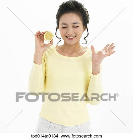 object, closing eyes, Asian, lemon, person, young lady, gesture View Large Photo Image Picture - object, closing eyes, Asian, lemon, person, young lady, gesture. Fotosearch