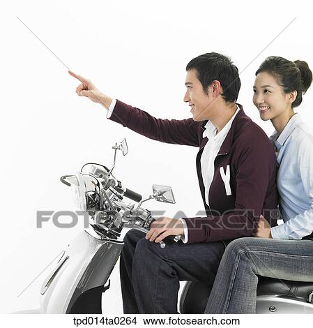 pointing, object, Asian, driving, person, woman View Large Photo Image Picture - pointing, object, Asian, driving, person, woman. Fotosearch