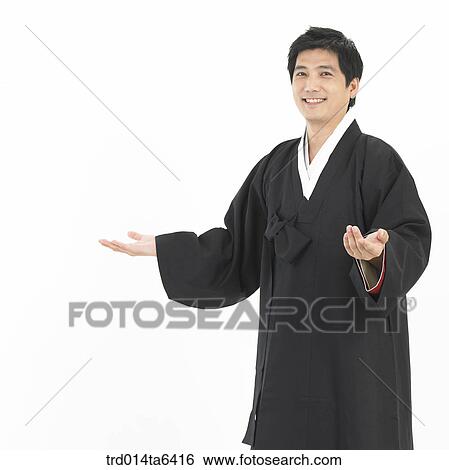 Stock Photograph - pointing, object, Asian, festival, smile, clothes. Fotosearch