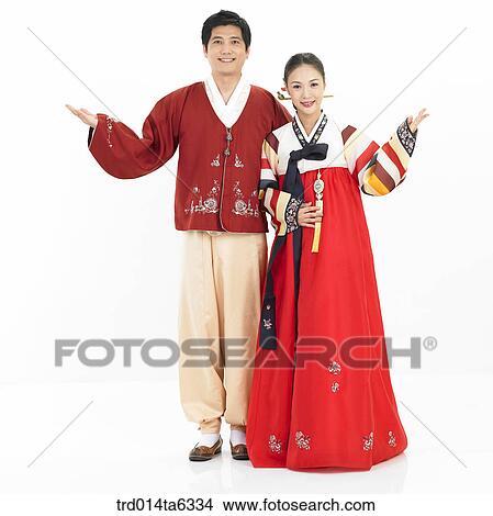 Picture - pointing, object, Asian, smile, clothes, couple. Fotosearch