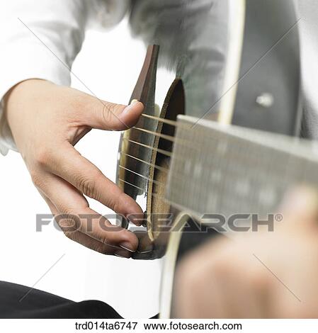 Stock Photo - person, body, hand, closeup, music, art, guitar. Fotosearch