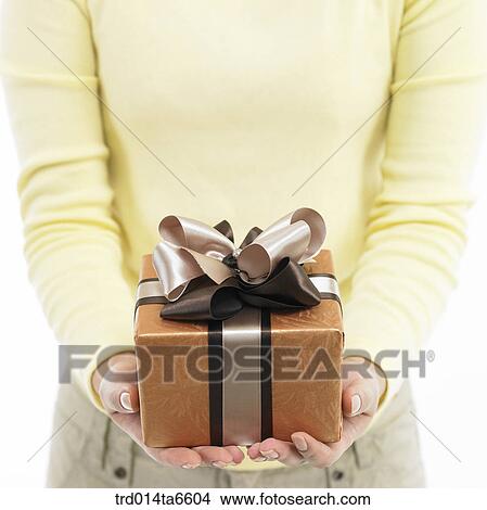 Picture - person, body, hand, closeup, object, gift. Fotosearch