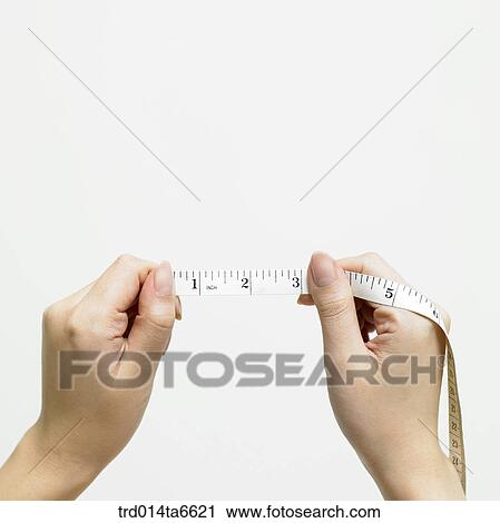 Stock Image - person, body, hand, closeup, object, device, supply. Fotosearch