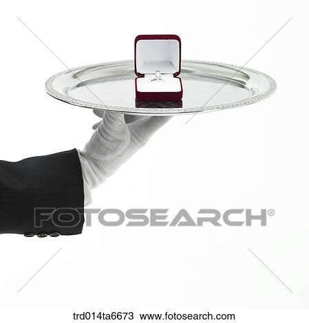 Stock Image - person, body, hand, closeup, object, gloves, silver plate. Fotosearch