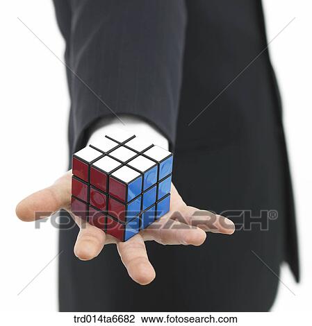 Stock Image - person, body, hand, closeup, object, toy, puzzle. Fotosearch