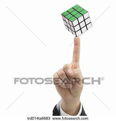 Stock Image - person, body, hand, closeup, object, toy, puzzle. Fotosearch
