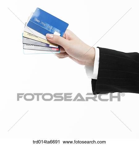 Stock Image - person, body, hand, closeup, object, credit card, card. Fotosearch