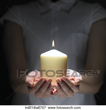 Stock Photo - person, body, hand, closeup, object, candle, candle. Fotosearch