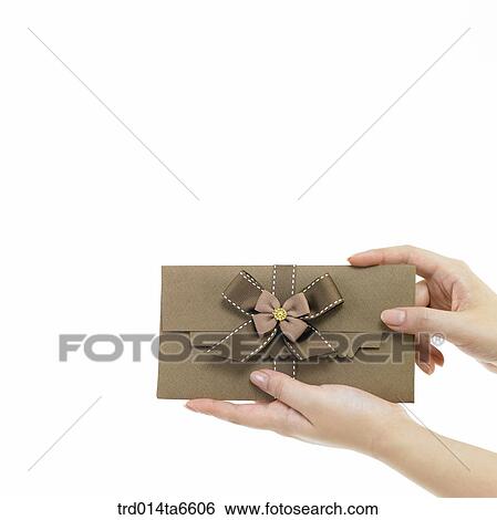 Stock Photograph - person, body, hand, closeup, object, gift, envelope. Fotosearch