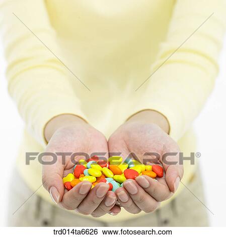Stock Photograph - person, body, hand, closeup, object, snack, food. Fotosearch