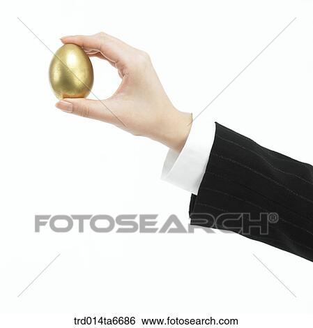 person, body, hand, closeup, object, golden egg, egg View Large Photo Image Stock Photograph - person, body, hand, closeup, object, golden egg, egg. Fotosearch