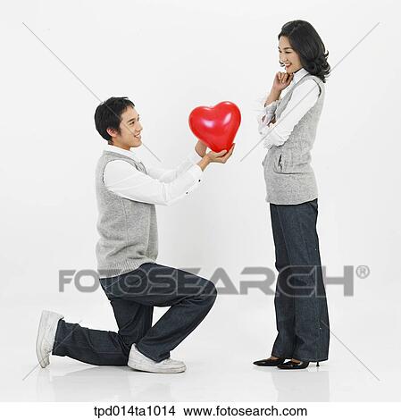 person, Asian, Korean, woman, object, couple View Large Photo Image Picture - person, Asian, Korean, woman, object, couple. Fotosearch