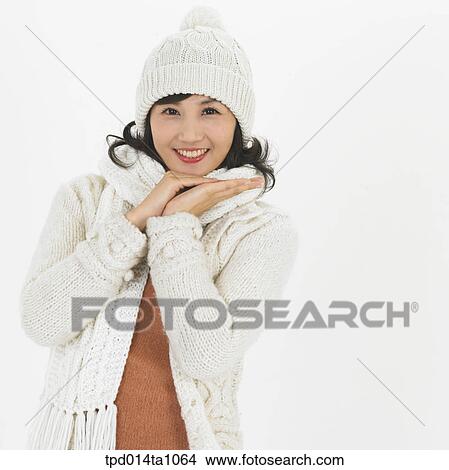 person, Asian, Korean, woman, object, winter, muffler View Large Photo Image Picture - person, Asian, Korean, woman, object, winter, muffler. Fotosearch