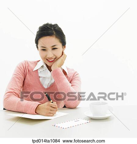 person, Asian, Korean, woman, object, letter, sitting View Large Photo Image Picture - person, Asian, Korean, woman, object, letter, sitting. Fotosearch