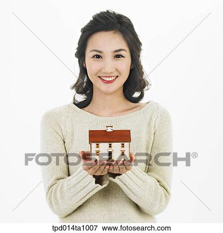 Stock Photo - person, Asian, Korean, woman, object, real estate, model house. Fotosearch