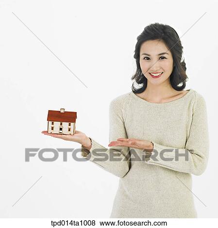 Stock Photo - person, Asian, Korean, woman, object, real estate, model house. Fotosearch