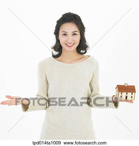 Stock Photo - person, Asian, Korean, woman, object, real estate, model house. Fotosearch