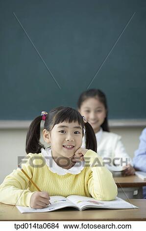 Picture - classroom, education, Asian, smile, person, school hours, inside. Fotosearch