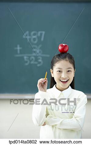 Stock Image - fruit, classroom, education, Asian, above, smile, apple. Fotosearch