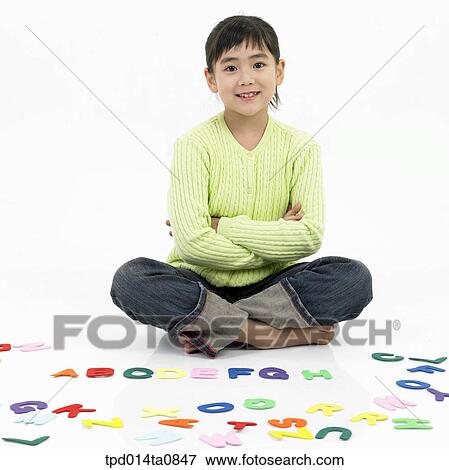 Stock Photo - education, object, Asian, smile, person, alphabet, child. Fotosearch