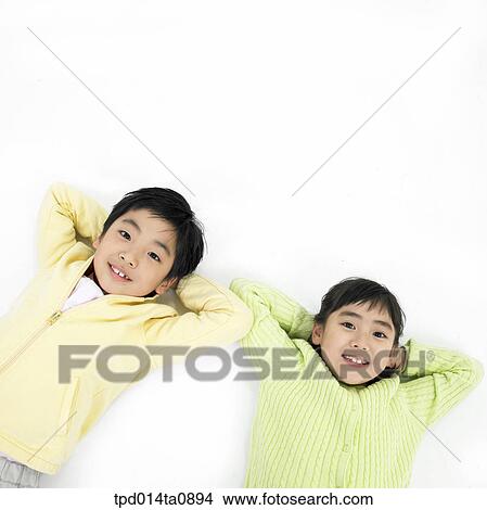 Picture - education, object, lying, Asian, smile, person. Fotosearch