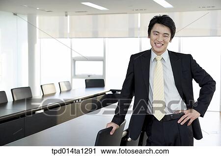 Stock Image - person, Asian, Korean, inside, business, businessman. Fotosearch