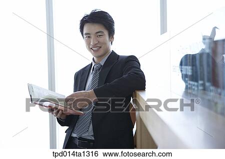 Stock Photograph - person, Asian, Korean, inside, business, businessman. Fotosearch