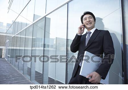 Stock Image - person, Asian, Korean, outside, day, daytime. Fotosearch