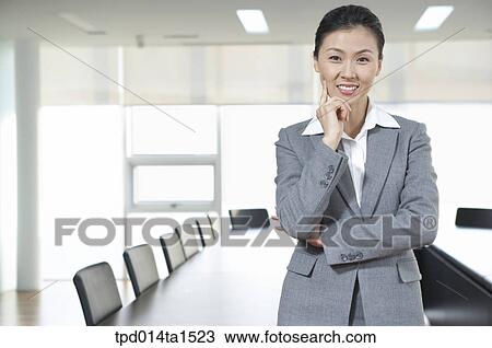 Stock Image - person, Asian, Korean, woman, inside, business, businesswoman. Fotosearch