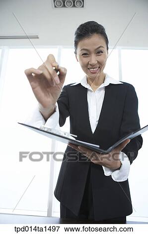 Stock Photo - person, Asian, Korean, woman, inside, business, businesswoman. Fotosearch