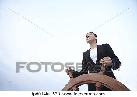 Stock Image - person, Asian, Korean, woman, outside, day, daytime. Fotosearch