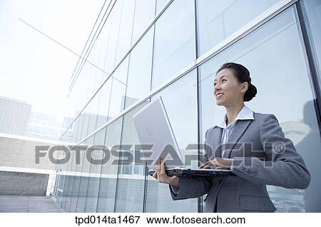 Stock Photo - person, Asian, Korean, woman, outside, day, daytime. Fotosearch