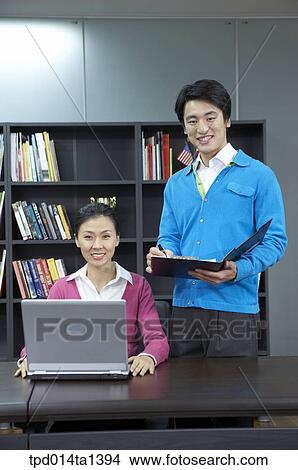 person, Asian, Korean, woman, colleague, inside View Large Photo Image Picture - person, Asian, Korean, woman, colleague, inside. Fotosearch