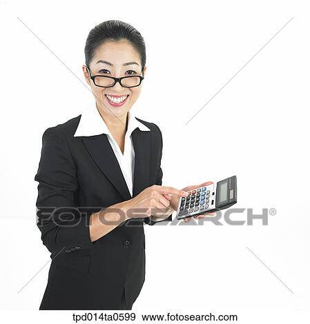 Stock Photo - calculator, object, Asian, business, businesswoman, person, woman. Fotosearch