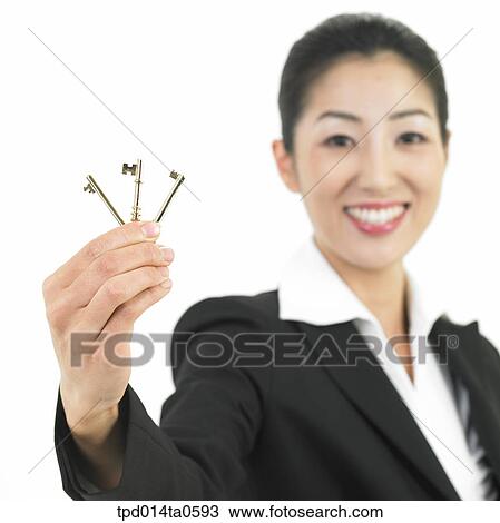 Stock Image - object, Asian, business, businesswoman, person, woman, key. Fotosearch