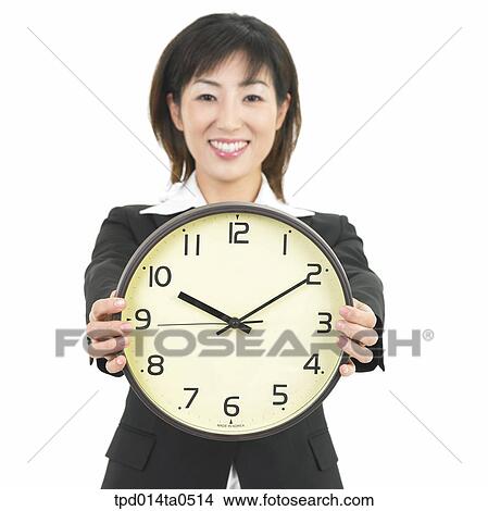 object, Asian, wall clock, business, businesswoman, person, time View Large Photo Image Picture - object, Asian, wall clock, business, businesswoman, person, time. Fotosearch