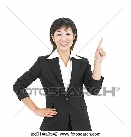 Stock Image - pointing, object, Asian, business, businesswoman, person, woman. Fotosearch