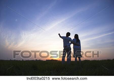 a couple's silhouette in a glow View Large Photo Image Stock Photography - a couple's silhouette in a glow. Fotosearch
