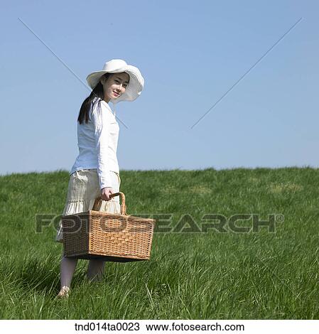 a woman holding a lunch box View Large Photo Image Stock Image - a woman holding a lunch box. Fotosearch