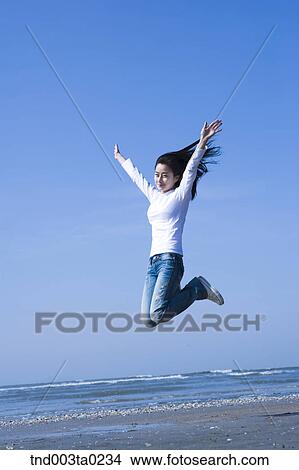 a woman in a seashore View Large Photo Image Picture - a woman in a seashore. Fotosearch