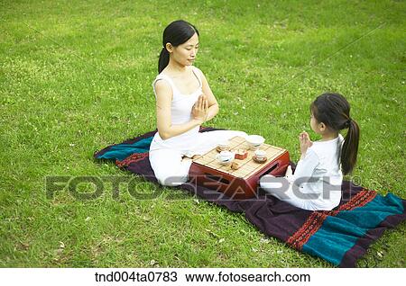 a mother and a child doing Yoga View Large Photo Image Stock Image - a mother and a child doing Yoga. Fotosearch
