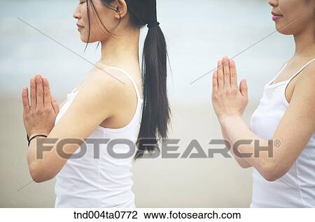 a woman doing Yoga in a seashore View Large Photo Image Stock Image - a woman doing Yoga in a seashore. Fotosearch