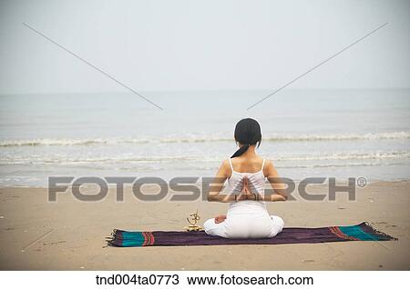 a woman doing Yoga in a seashore View Large Photo Image Stock Image - a woman doing Yoga in a seashore. Fotosearch