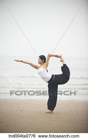 a woman doing Yoga in a seashore View Large Photo Image Stock Photograph - a woman doing Yoga in a seashore. Fotosearch